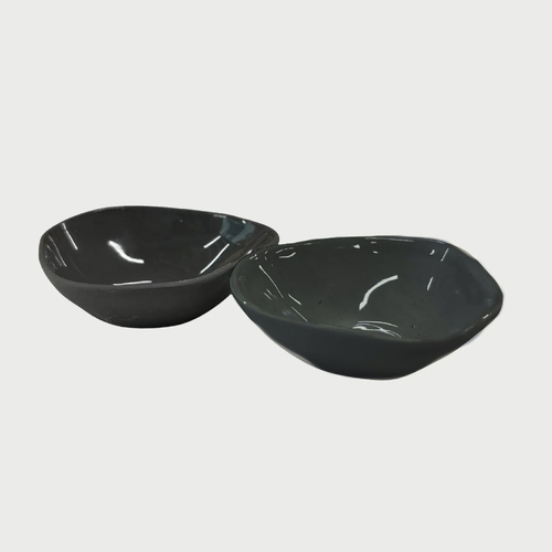 A Set of Salt and Pepper Condiment Bowls